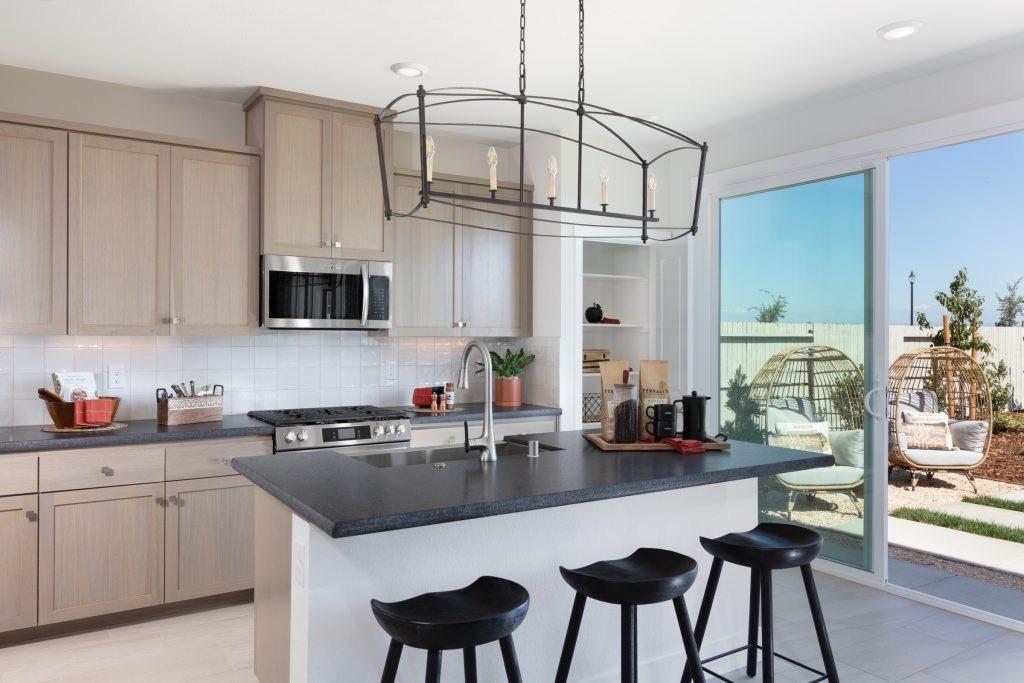 Open concept kitchen and dining area with natural lighting