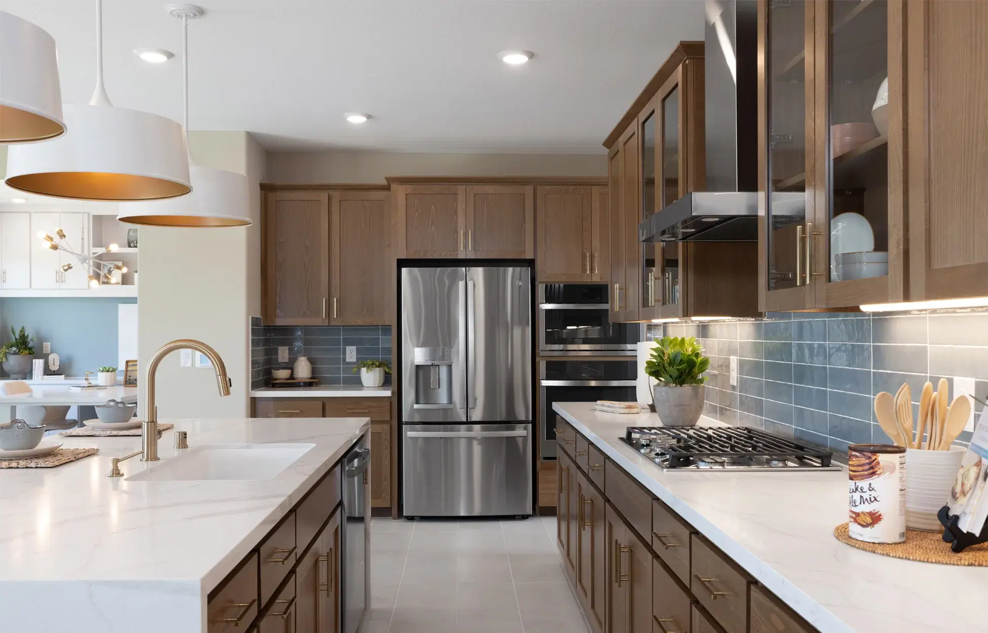 Contemporary kitchen with dark wood cabinets and marble countertops