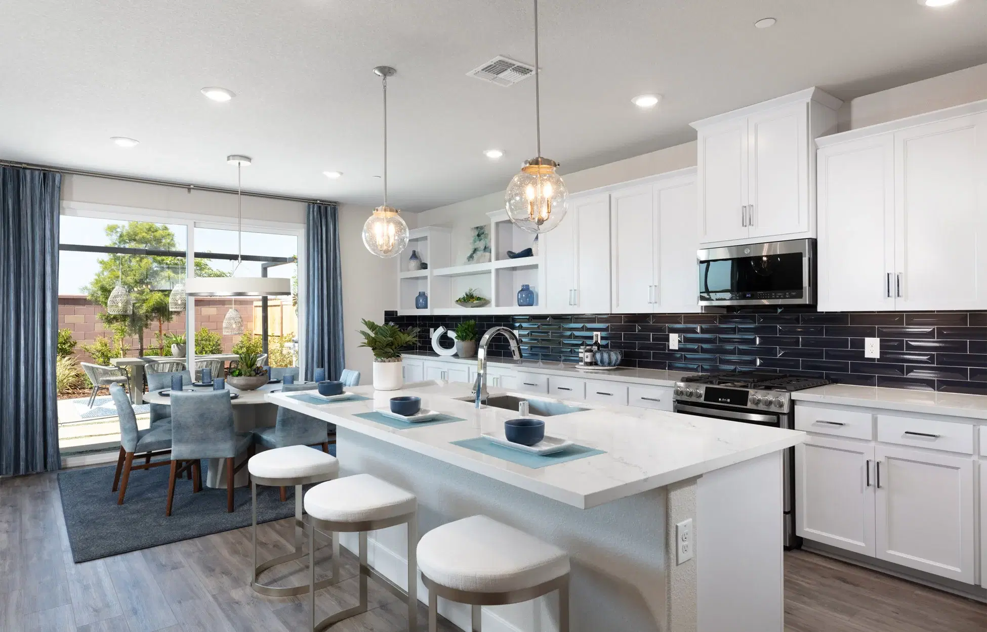 Kitchen island with bar seating and modern fixtures