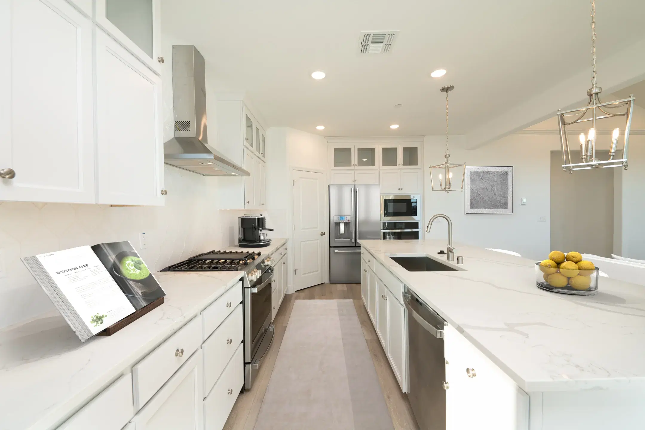 Contemporary kitchen with dark wood cabinets and marble countertops