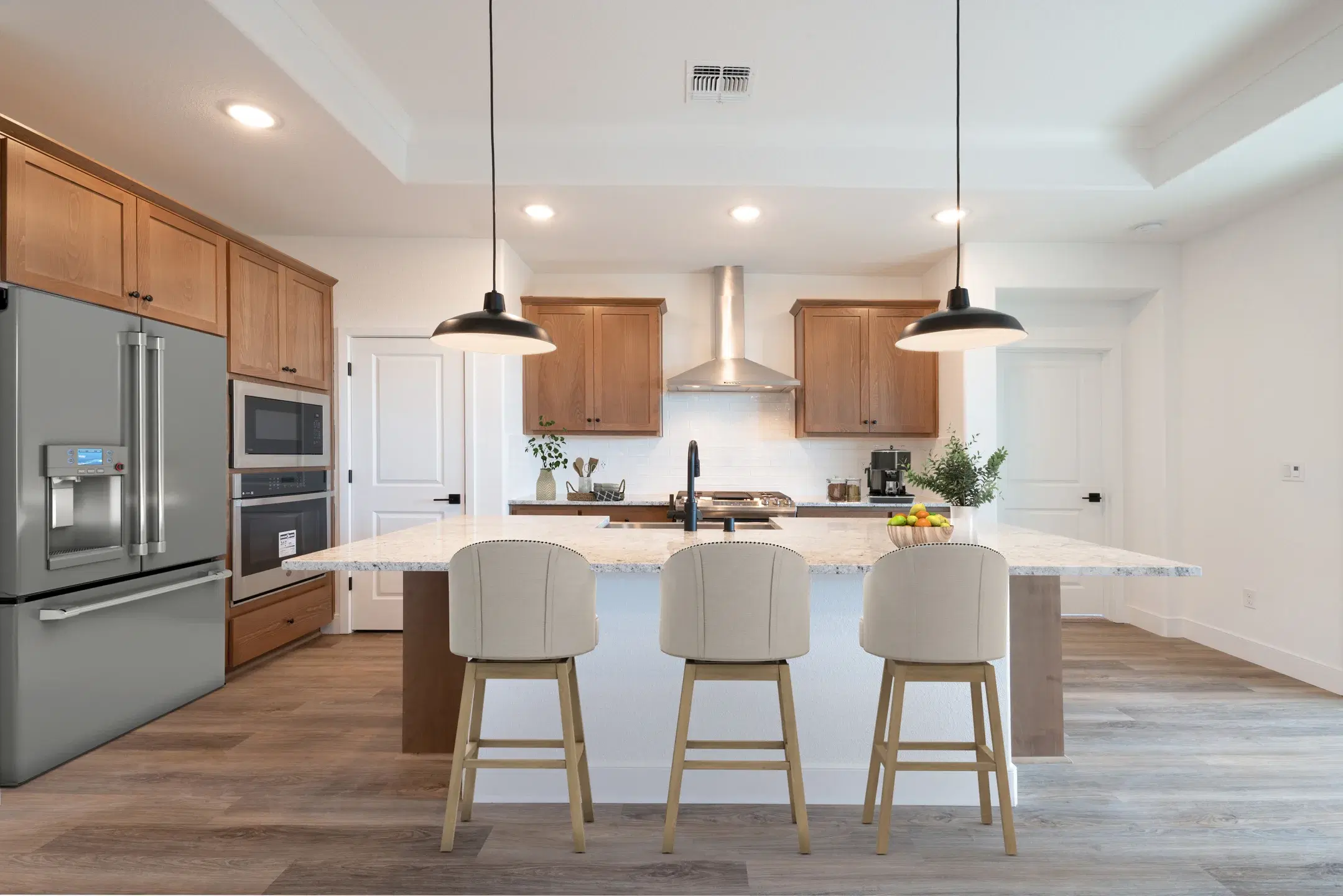 Kitchen island with bar seating and modern fixtures
