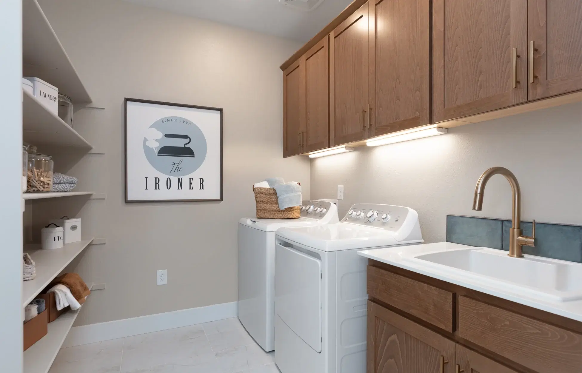Modern white kitchen with large island and pendant lights