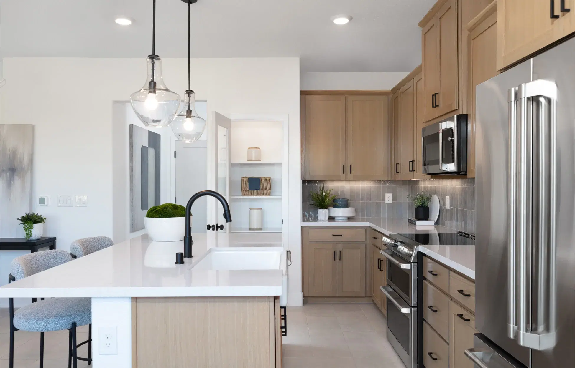 Kitchen island with bar seating and modern fixtures