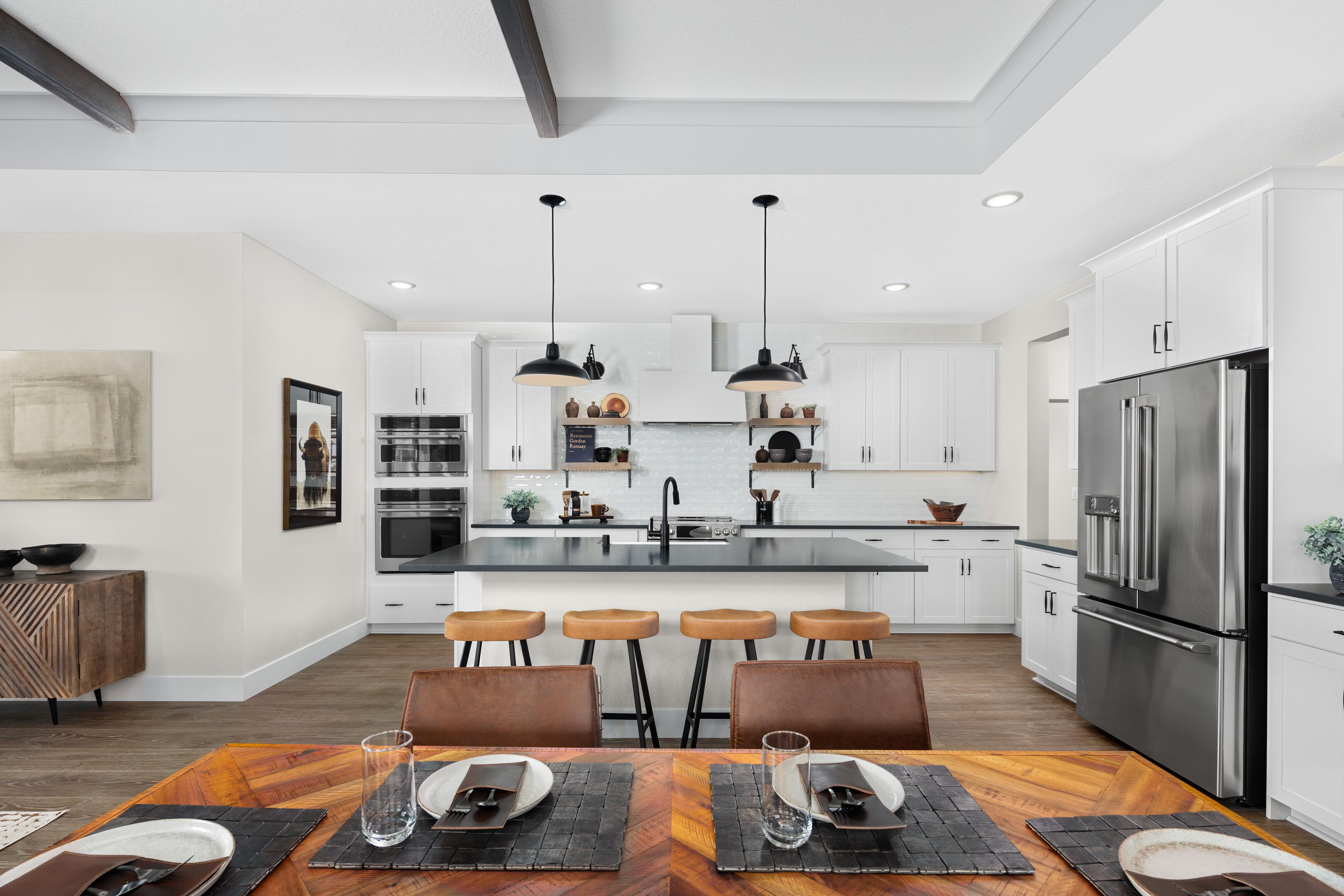 Open concept kitchen and dining area with natural lighting