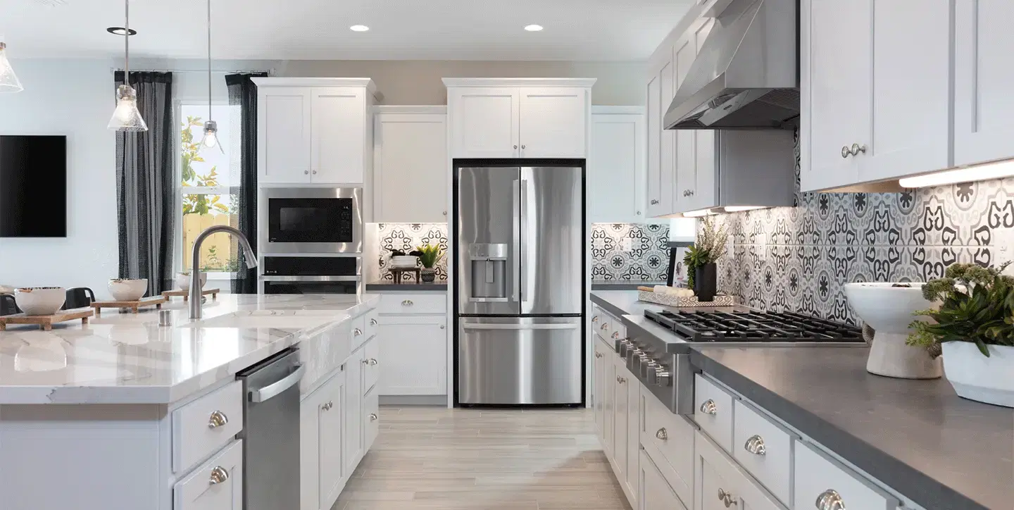 Contemporary kitchen with dark wood cabinets and marble countertops