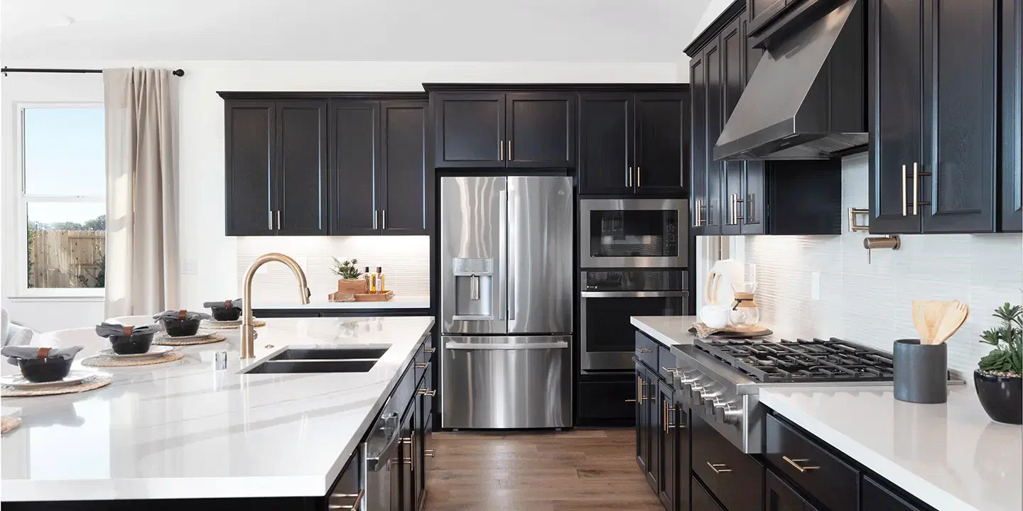 Contemporary kitchen with dark wood cabinets and marble countertops