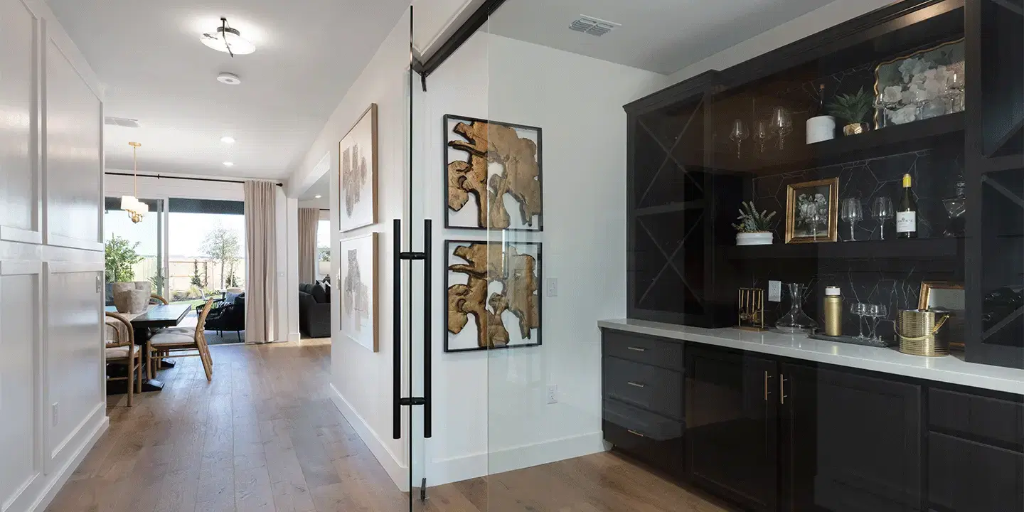 Contemporary kitchen with dark wood cabinets and marble countertops