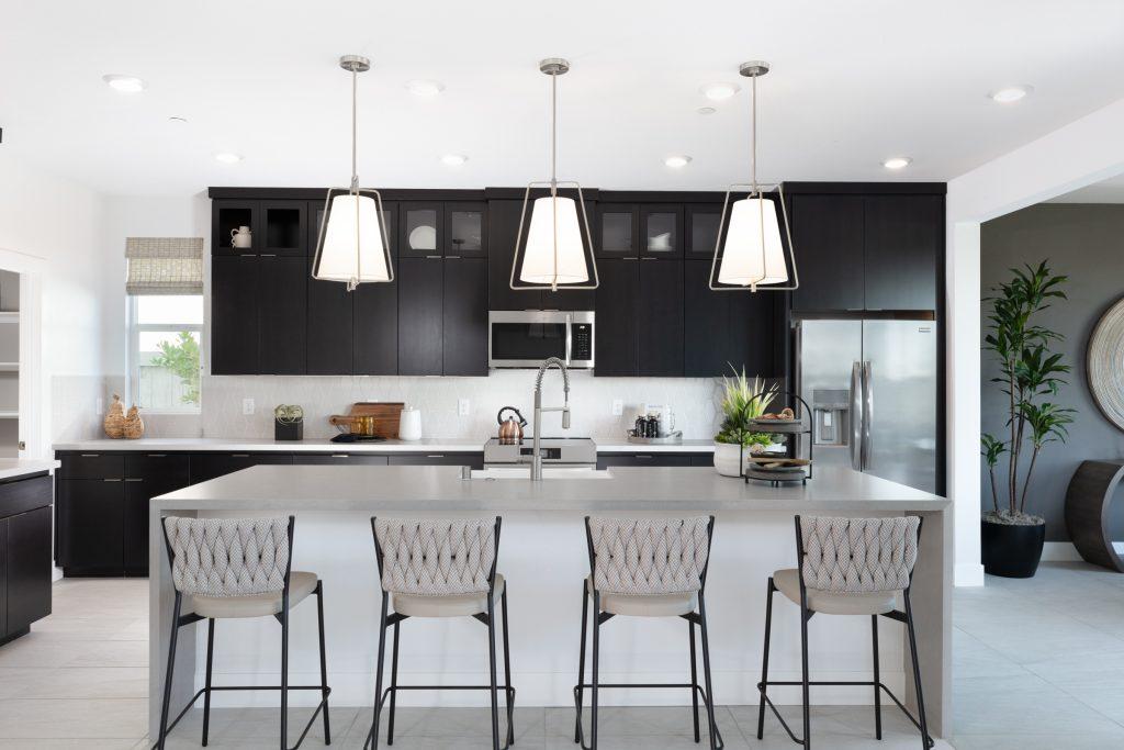 Kitchen island with bar seating and modern fixtures